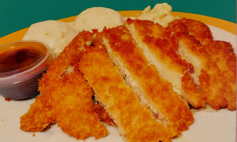 Breaded crispy chicken cutlet with sides and dipping sauce at Lanikai BBQ Tea House, a Asian Fusion Restaurant in San Francisco