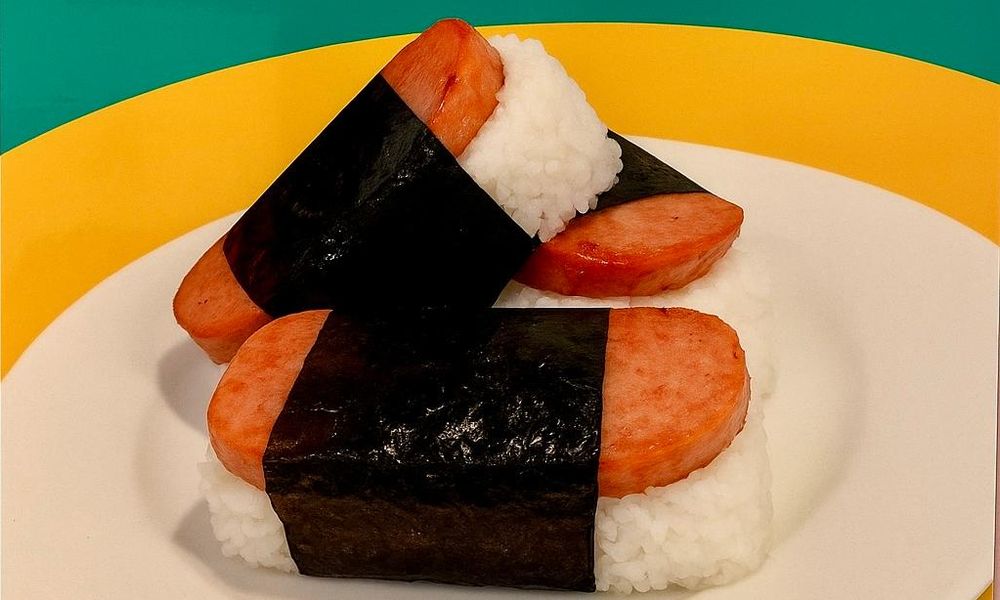 Rice balls wrapped in nori, filled with sliced sausage at Lanikai BBQ Tea House, a Asian Fusion Restaurant in San Francisco